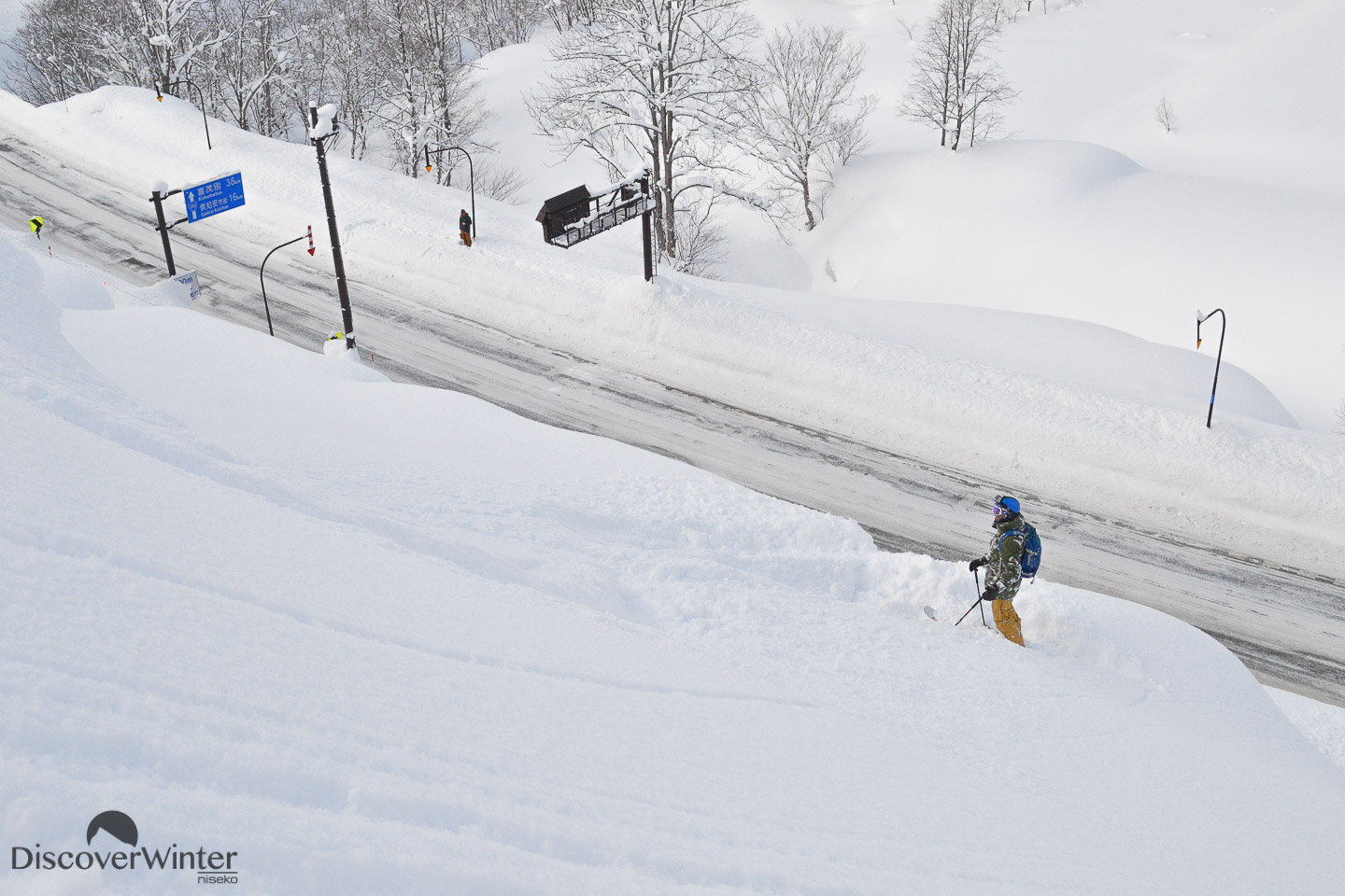 Jackson Sloss scoping his line after sending it off the avalanche barriers
